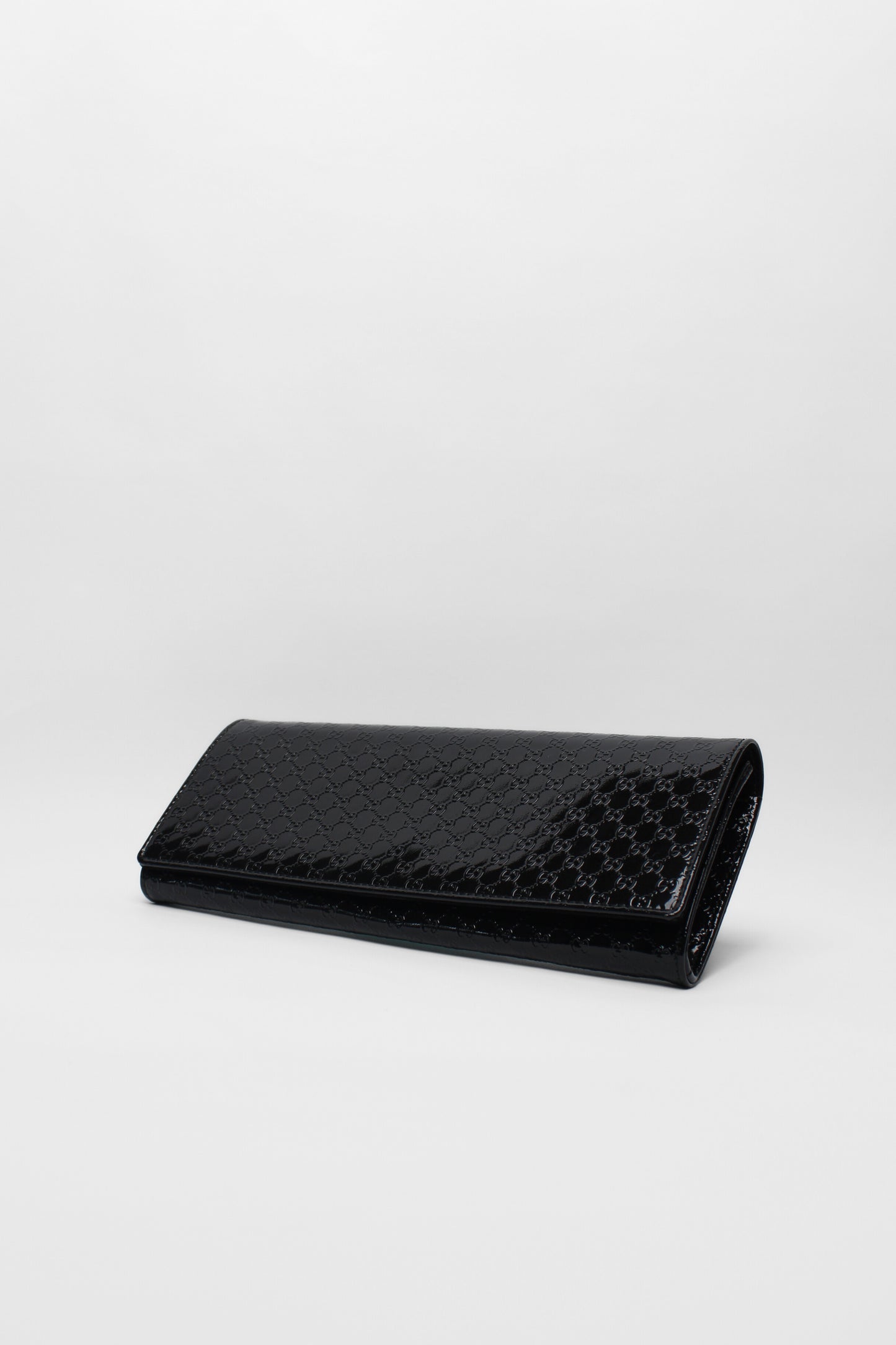 Gucci patent black leather clutch bag