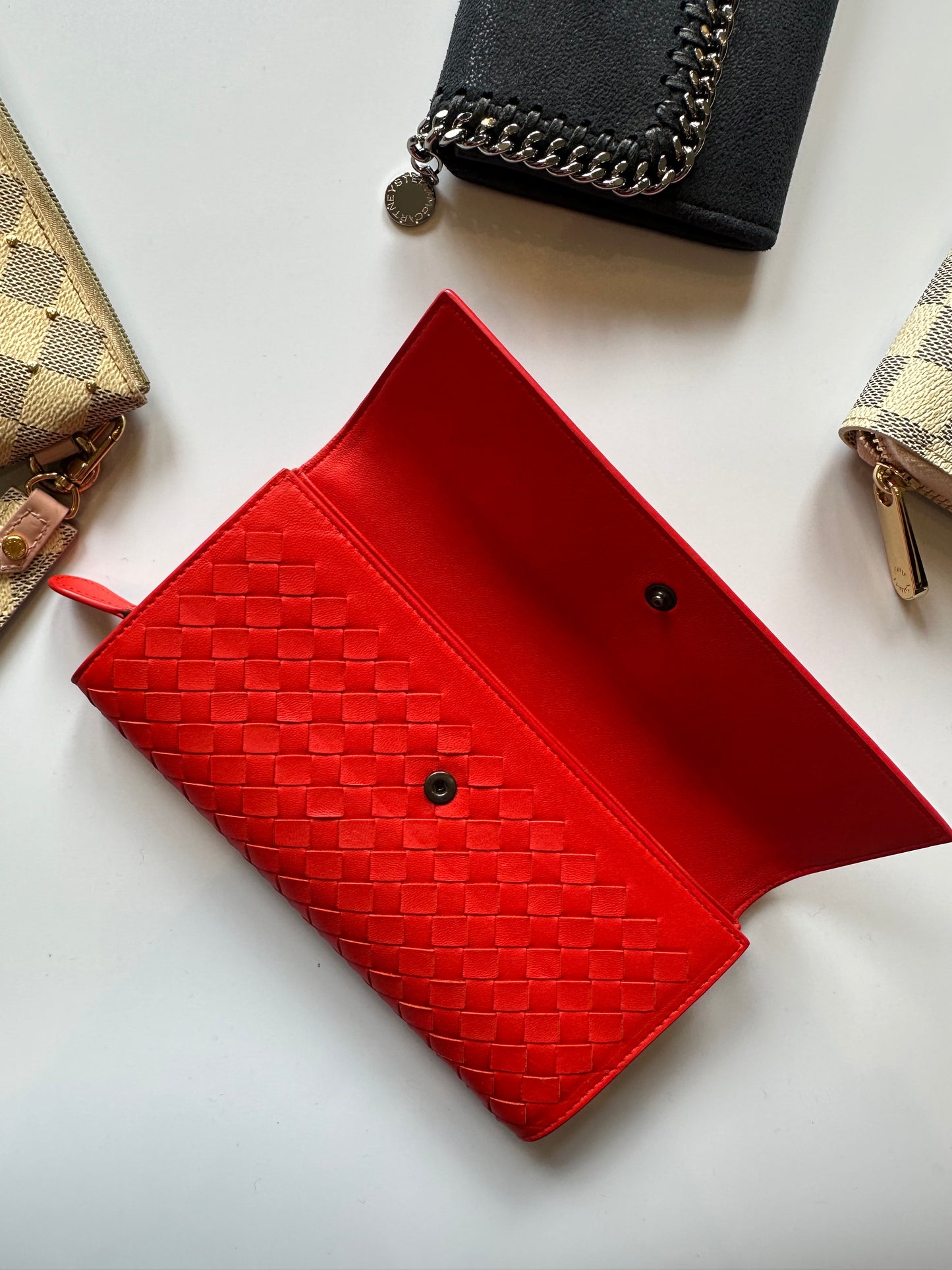 Bottega Veneta red woven wallet